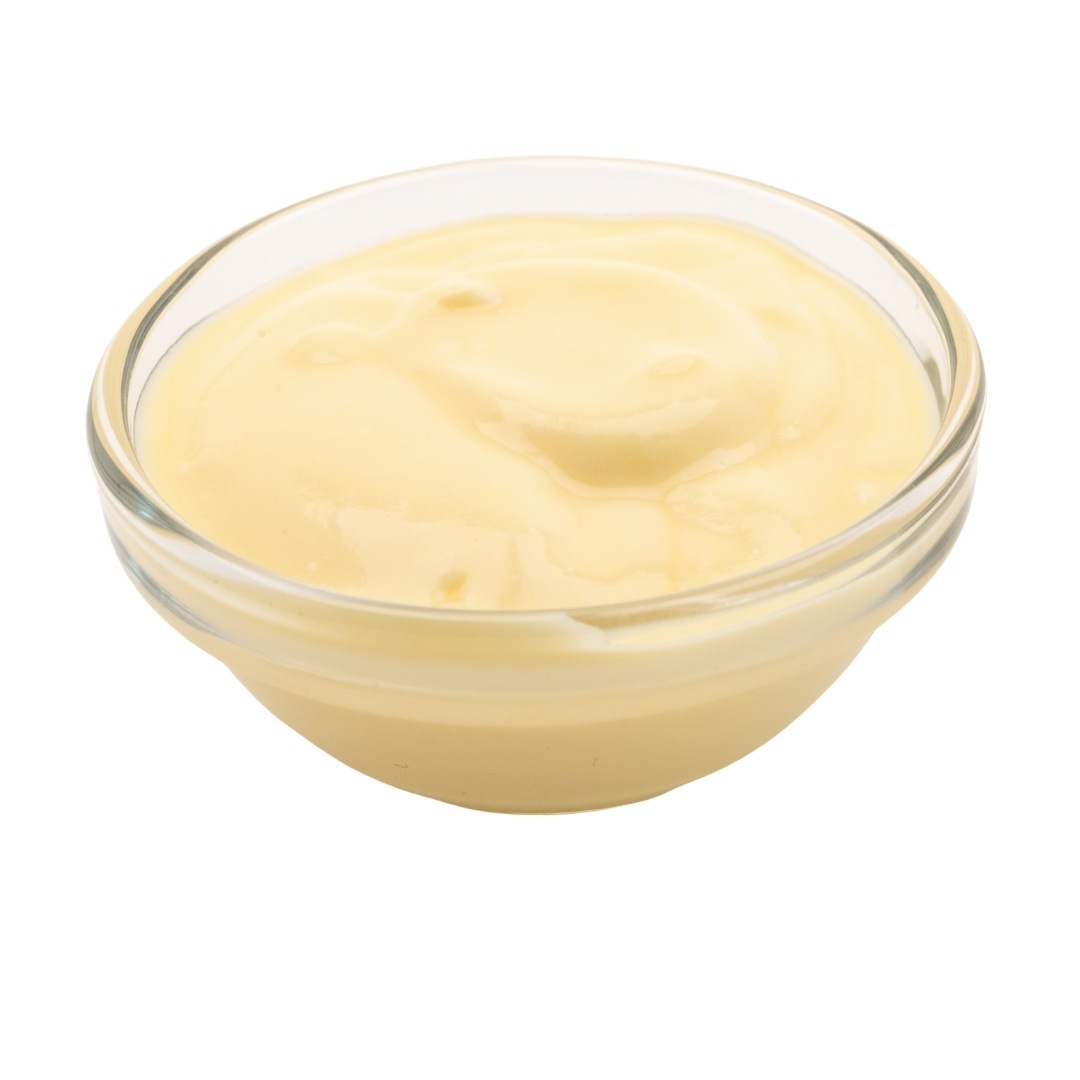 Yellow cream cheese in a small glass bowl