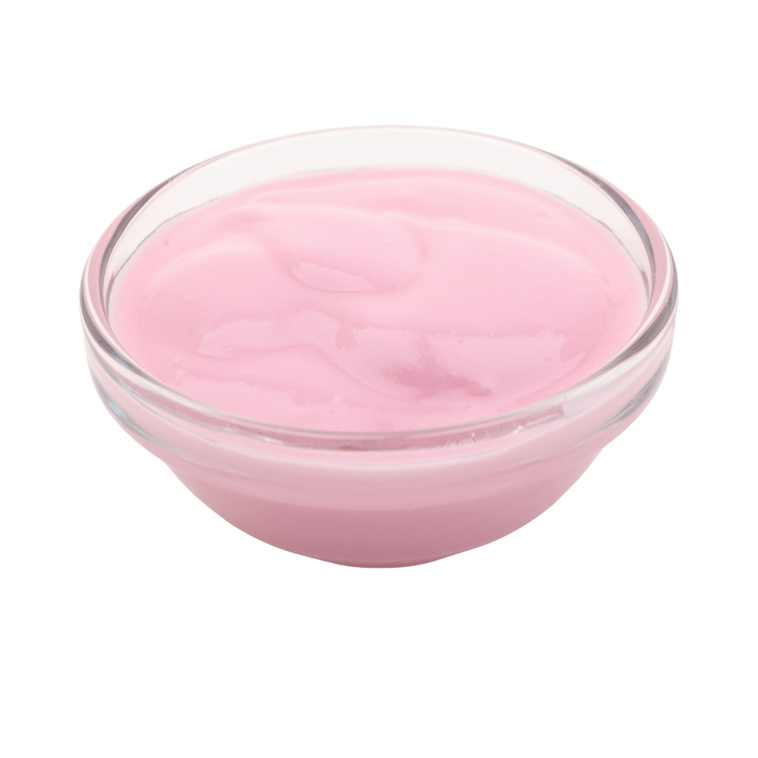 Red cream cheese in a small glass bowl