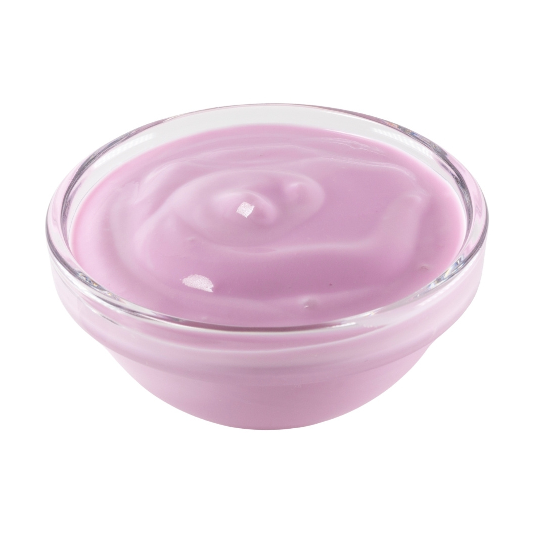 Puple cream cheese in a small glass bowl