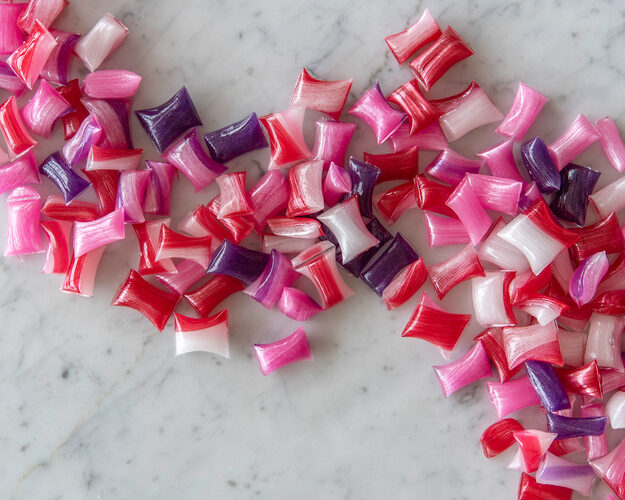 Pink, purple and red hard panned confectionery