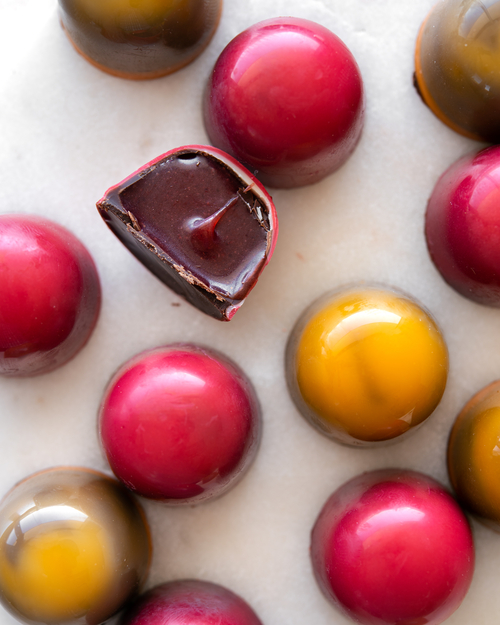 Pink and yellow colored chocolates
