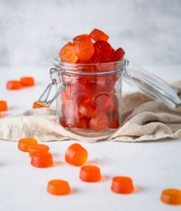 Orange gummies in a jar