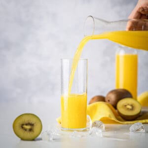 Golden kiwi juice in a glass