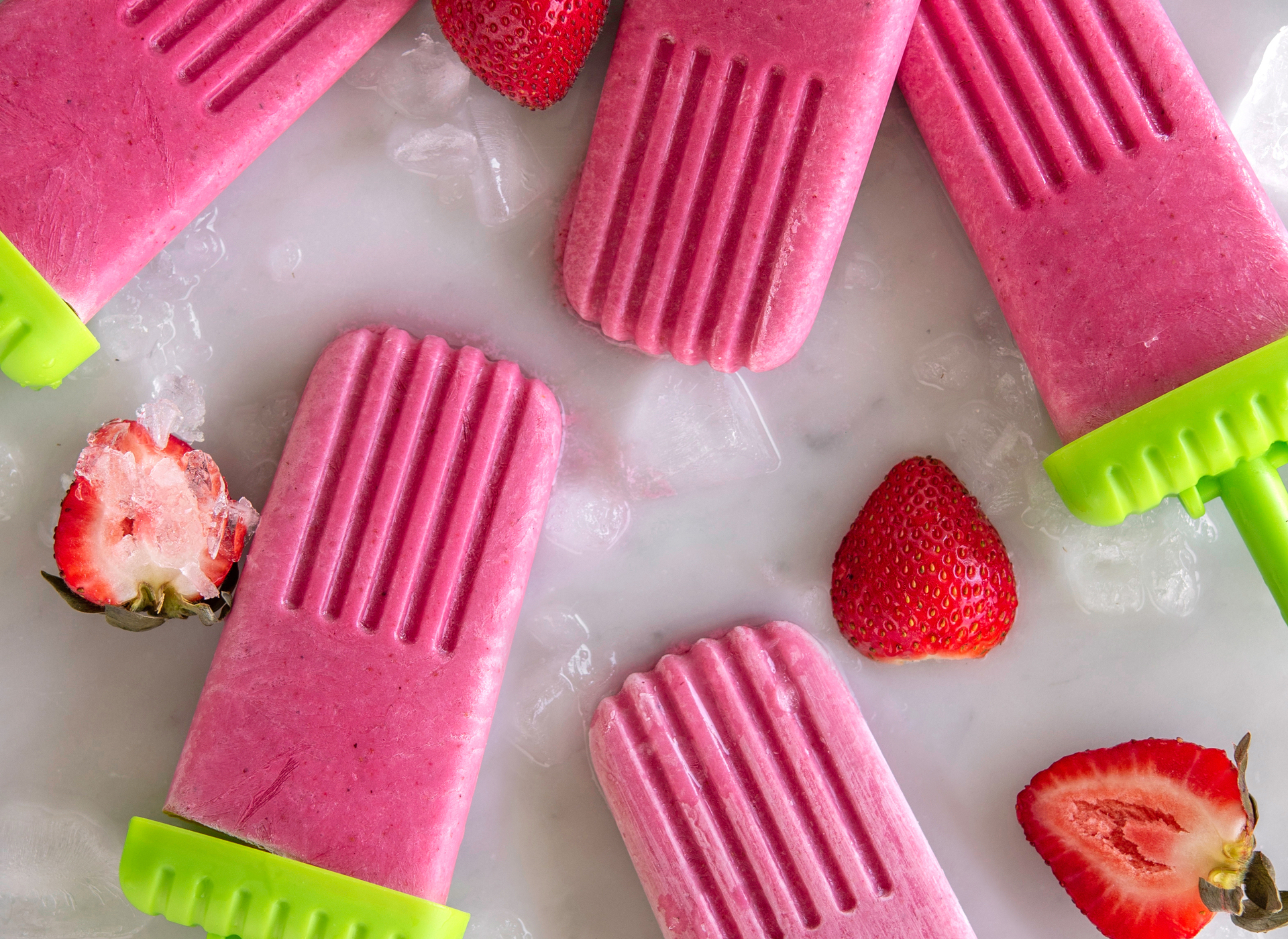 Pink strawberry popsicles