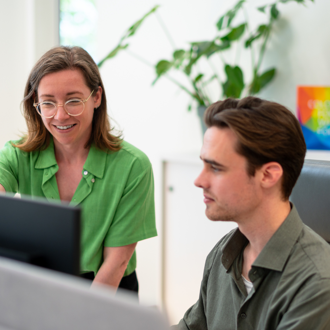 Two GNT employees at work in the office