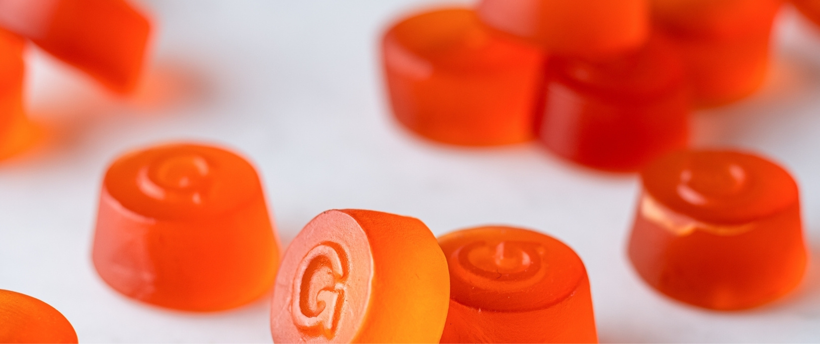 Orange gummies colored with paprika emulsion