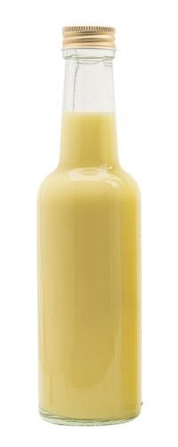 Yellow cream liqueur in a glass bottle