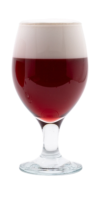 A glass of dark red colored beer