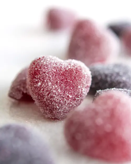 Pink confectionery with sugar in heart form