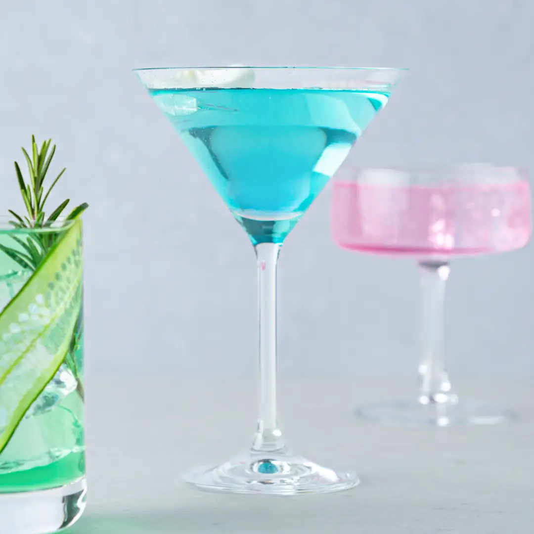Three mocktails in green, blue and pink